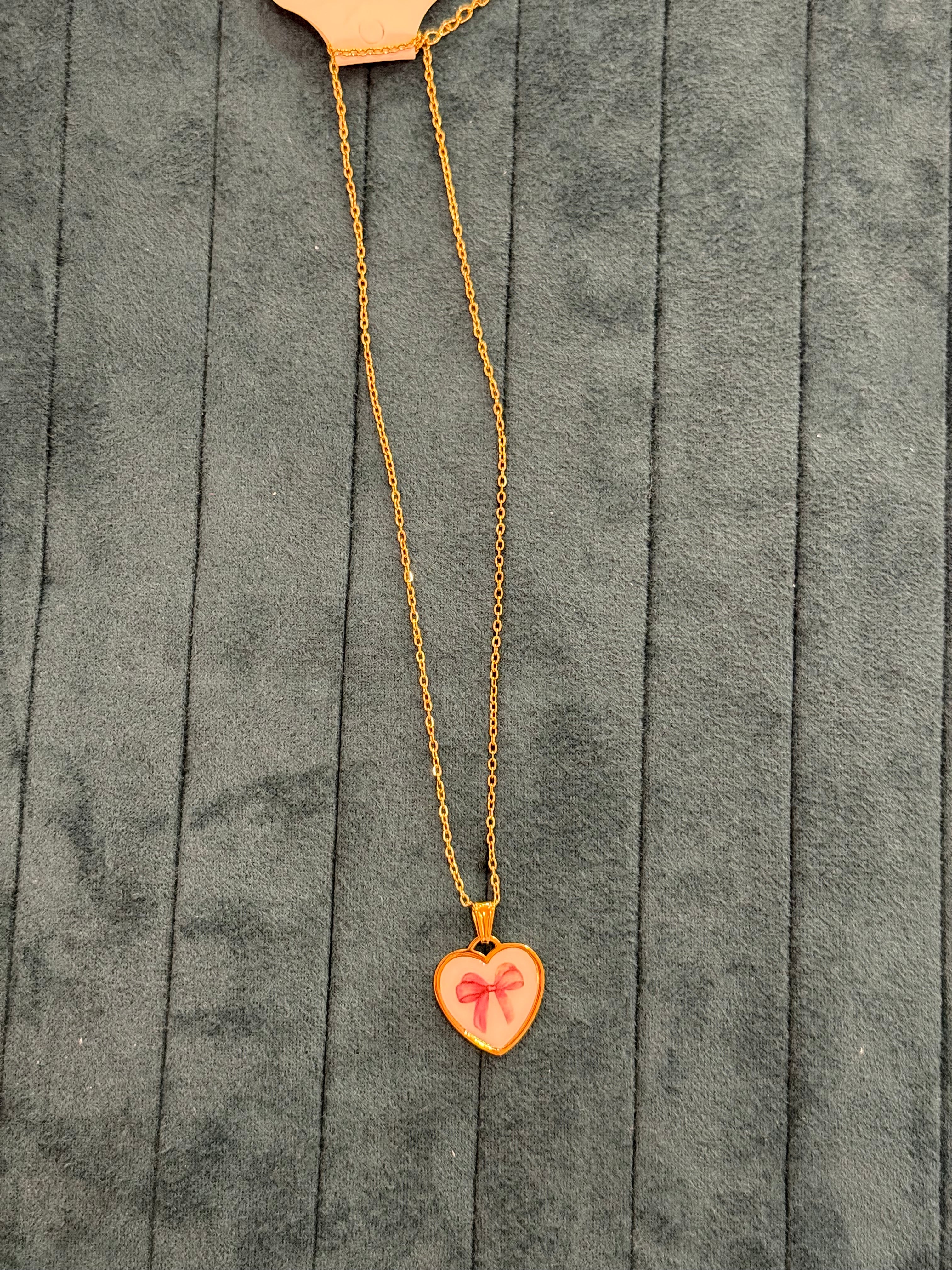 COLLANA CUORE CON FIOCCO ROSA